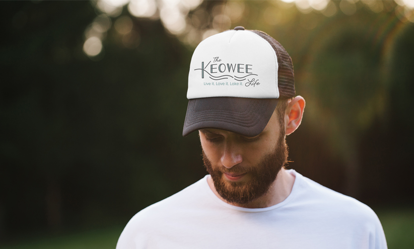 The Keowee Life branding by Annatto. Branded baseball cap.
